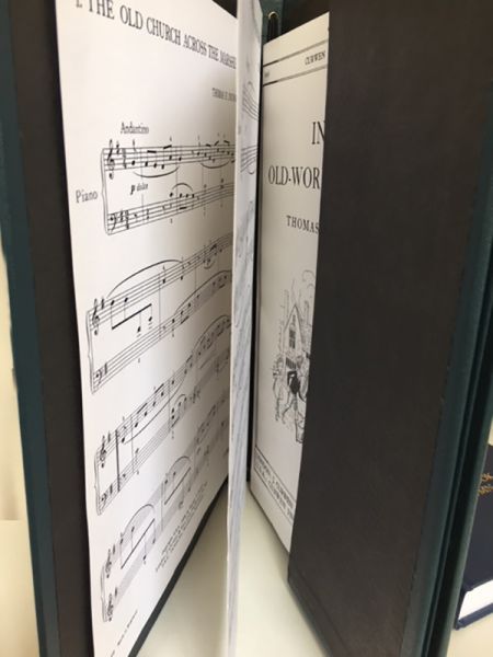 Choir folder holding music